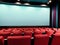 Cinema auditorium with red seats and large screen. Generative AI