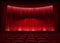 Cinema auditorium with stage curtain.