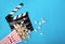 Cinema background. Popcorn and clapperboard on blue background