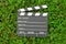 Cinema clapper board on green grass