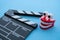 Cinema clapperboard with chattering teeth toy on blue wooden background - Funny, comedy or humor movie style, film industry