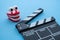 Cinema clapperboard with chattering teeth toy on blue wooden background - Funny, comedy or humor movie style, film industry