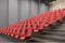 Cinema interior corner, red chairs, gray