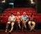Cinema is our culture. Portrait of a group of confident seniors sitting in the front row of an empty movie theatre.