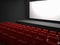 Cinema seats and white blank screen
