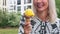 Cinemagraph of blond woman eating ice cream outdoors