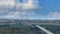 Cinemagraph - Clouds floating over the industrial urban landscape on autumn day. Lingotto pedestrian bridge, Turin