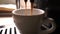 Cinemagraph. Coffee poured into a cup of coffee machine, video loop