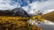 Cinemagraph Continuous Loop Animation. Alpine Lake, Rocks and Snowy Mountains in Canadian Nature.