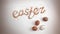 Cinemagraph - Easter lettering made of colorful baking sugar with eggs and one egg spinning. Looping Motion Photo.