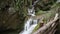 Cinemagraph effect of waterfalls with partially still water in a gorge