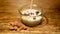 Cinemagraph of glass bowl with cereal and fresh milk