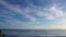 Cinemagraph of peaceful seascape with clouds on sunny day. ocean view