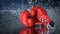 Cinemagraph of red boxing gloves on a water drops background. Sport lifestyle. Motivation. Goal achievement. Protect yourself.