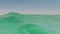 Cinemagraph of underwater split shot view showing above and below the water level of the Dead Sea in Israel