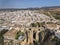 Cinematic Aerial perspective of Ronda landscape and buildings with Puente Nuevo Bridge