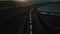 Cinematic Aerial View of Freight Train Under Sunset, San Bernandino, California