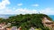 Cinematic Aerial view of Morro de Sao Paulo Lighthouse, small village and ocean