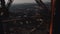 Cinematic background shot, camera is inside glass elevator moving up inside Paris Eiffel Tower steel structure bars.