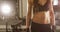 Cinematic body portrait of active fitness woman`s waist and well trained stomach