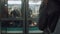 Cinematic close-up camera follows woman waiting for metro train at station platform doors, entering train slow motion.