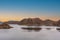 Cinematic lake surrounded by red cliffs in Provincia de Mendoza, Argentina