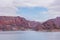 Cinematic lake surrounded by red cliffs in Provincia de Mendoza, Argentina