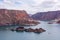 Cinematic lake surrounded by red cliffs in Provincia de Mendoza, Argentina