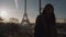 Cinematic portrait of happy attractive tourist woman posing at sunrise Paris Eiffel Tower on romantic trip slow motion.