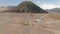 Cinematic shot aerial view of beautiful Mount Bromo volcano with desert in East Java