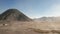 Cinematic shot aerial view of beautiful Mount Bromo volcano with desert in East Java