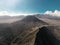 Cinematic shot aerial view of beautiful Mount Bromo volcano peak with desert in East Java