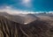 Cinematic shot aerial view of Mount Bromo crater with active volcano smoke in East Java