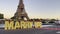 Cinematic shot man making surprise proposal of marriage to his beloved woman near eiffel tower with lighting while