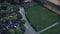 Cinematic shots in the slow motion of a heavy rain in the city, an overhead view of the backyard of a multi-storey building. Rainy