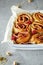 Cinnabon buns. Sinabon rolls with cream cheese, cream and brown sugar. Cinnamon rolls with raspberries and pistachios