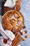 Cinnabon cinnamon rolls buns with pumpkin, nut, caramel and sugar cream iced. Top view. Sweet Homemade Pastry christmas baking.