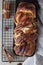 Cinnamon babka or swirl brioche bread on black metal grille. Cinnamon roll bread. European Easter sweet bread. Homemade pastry for