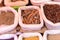 Cinnamon, badian and other spices in the bags at Indian market. Bags full of various spices on a market stall