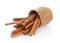 Cinnamon in basket on white background