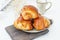 Cinnamon buns Christmas baking buns on a wooden breakfast table on a plate. The freshest homemade cakes Close-up