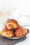 Cinnamon buns Christmas baking buns on a wooden breakfast table on a plate. The freshest homemade cakes Close-up