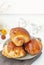 Cinnamon buns Christmas baking buns on a wooden breakfast table on a plate. The freshest homemade cakes Close-up. copy space