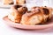 Cinnamon buns   in plate on morning table