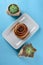 Cinnamon Danish Swirl-classic buttery danish pastry roll and two small succulent plant.