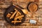 Cinnamon with dried lemon on wooden table