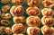 Cinnamon fresh baked sweet bun rolls dessert background on tray