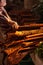 Cinnamon and laotian senior women hands at the local market in morning light. Pakse, Champasak, Laos. Warm tone. Beautiful light.