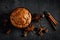 Cinnamon muffins on black background