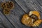 Cinnamon and poppy seed buns. Rich pastries. Nearby pine cones. Close-up shot